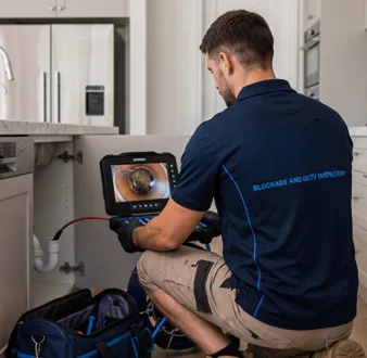 Clearing a blocked sink at a Meadowbank property
